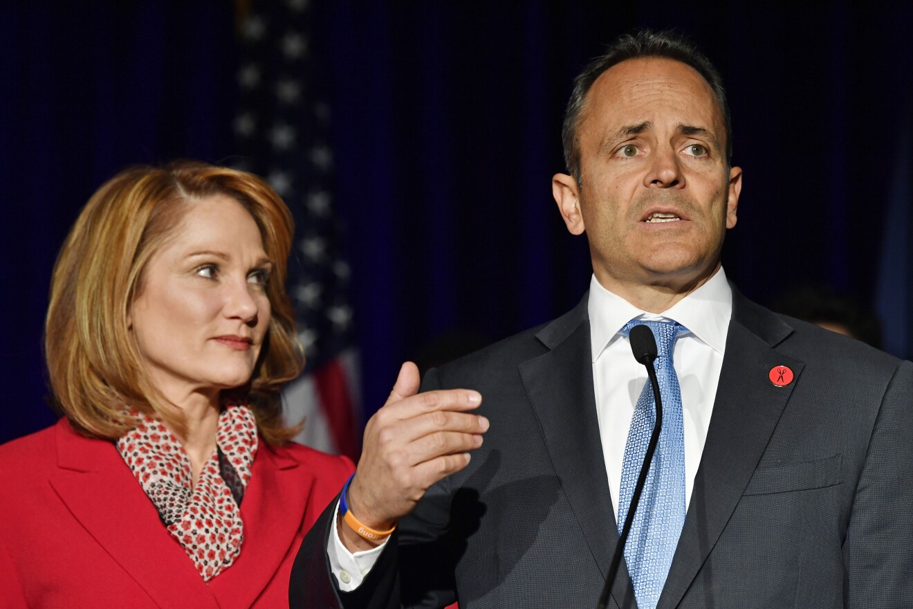 Kentucky Gov. Matt Bevin, right, with his wife Glenna, speaks to supporters gathered at the republican party celebration event in Louisville, Ky., Tuesday, Nov. 5, 2019.